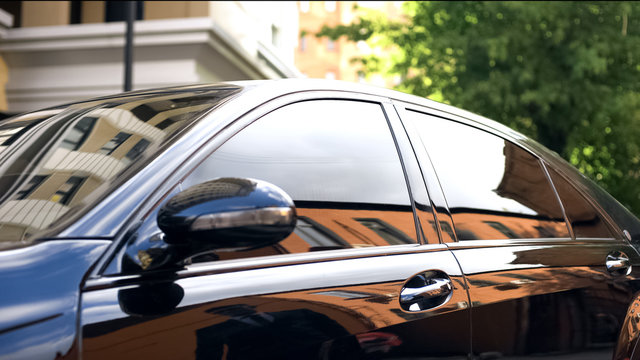 Sleek black luxury sedan showcasing high-performance automotive window tinting in Denton TX